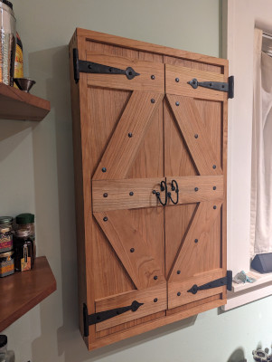 Spice cabinet in cherry with doors closed